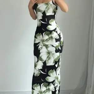 summer sleeveless floral print dress with a fitted waist and mid length design.